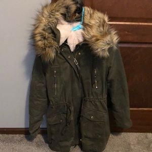 Olive green winter coat. Fur on the inside